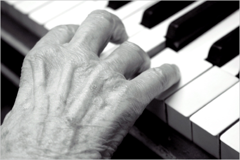 elderly hands playing piano