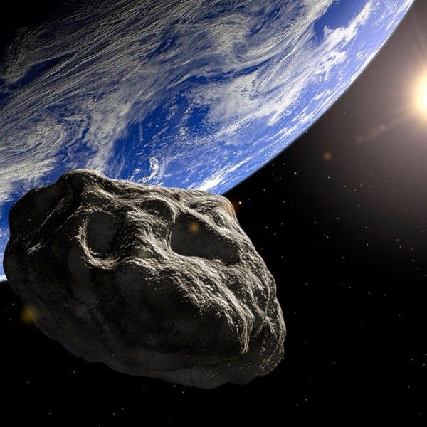 Artists rendering of an asteroid passing Earth