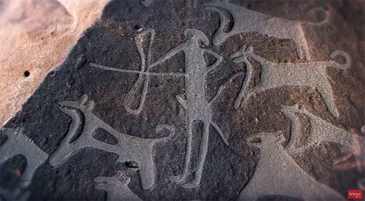 Dieses rund 8.000 Jahre alte Felsbild zeigt einen Jäger, der von Hunden begleitet wird - einige scheinen angeleint.
