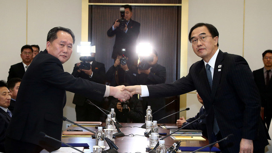 Head of the North Korean delegation, Ri Son Gwon shakes hands with South Korean counterpart Cho Myoung-gyon