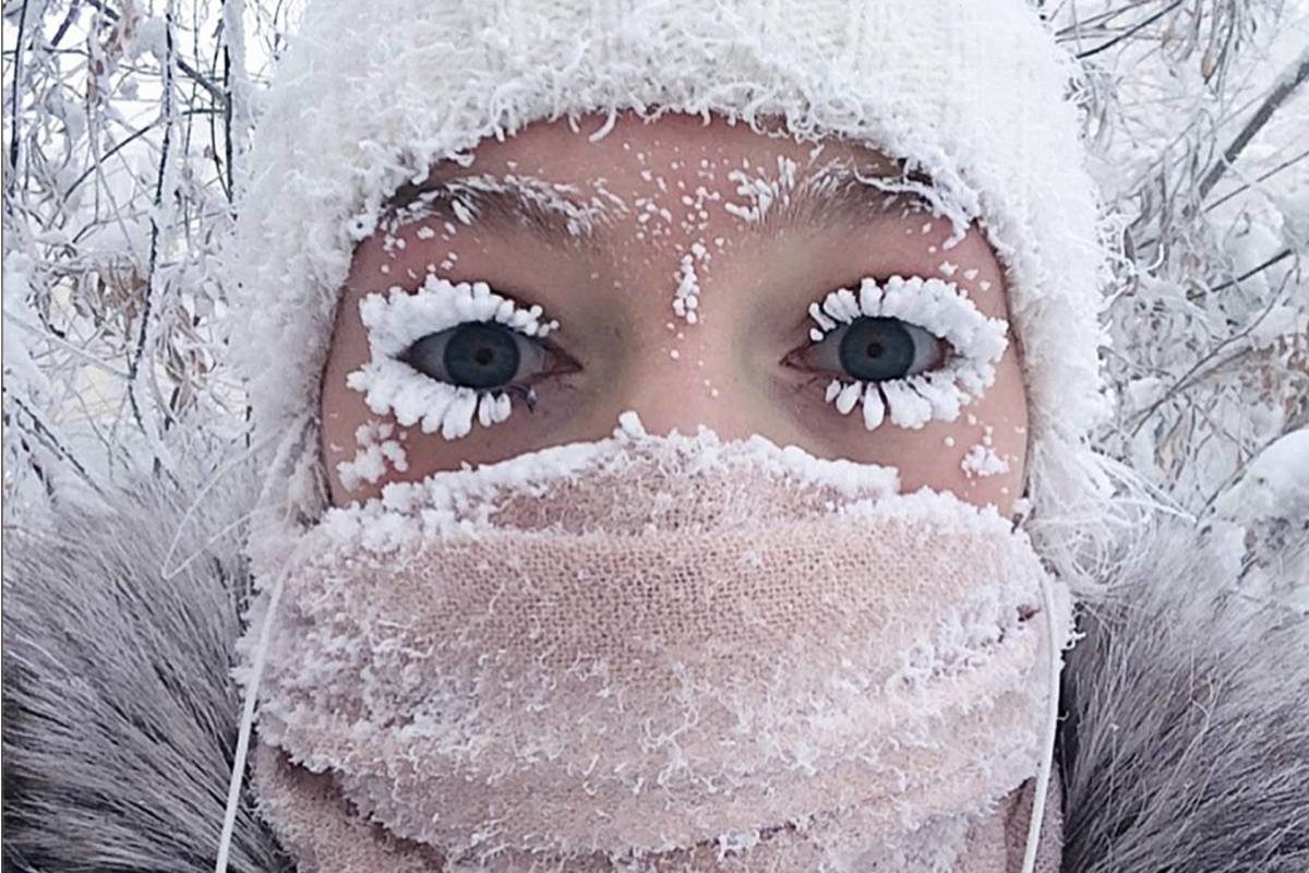 In this photo taken on Sunday, Jan. 14, 2018, Anastasia Gruzdeva poses for selfie as the Temperature dropped to about -50 degrees (-58 degrees Fahrenheit) in Yakutsk, Russia.