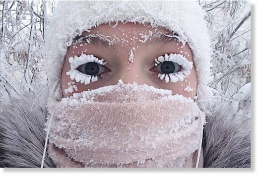 In this photo taken on Sunday, Jan. 14, 2018, Anastasia Gruzdeva poses for selfie as the Temperature dropped to about -50 degrees (-58 degrees Fahrenheit) in Yakutsk, Russia.