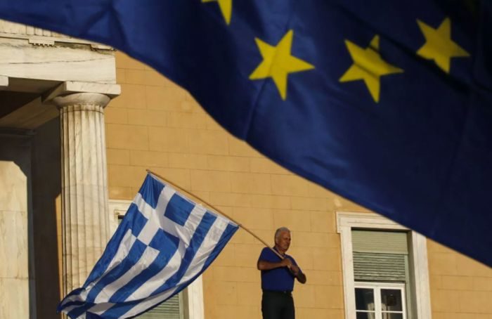 EU/Greece flag guy