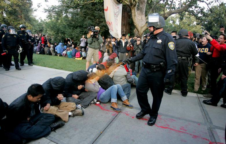 A University of California Davis police officer pepper-sprays students